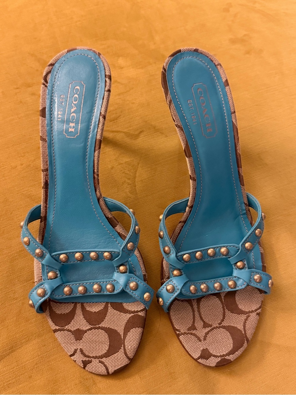 COACH Turquoise Studded Logo Slide Heels NWOT. 9 1/2 made in Italy.
